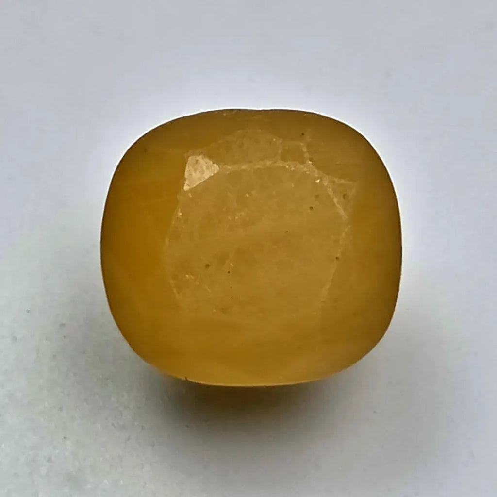 Ceylon Yellow Sapphire on a white background online India