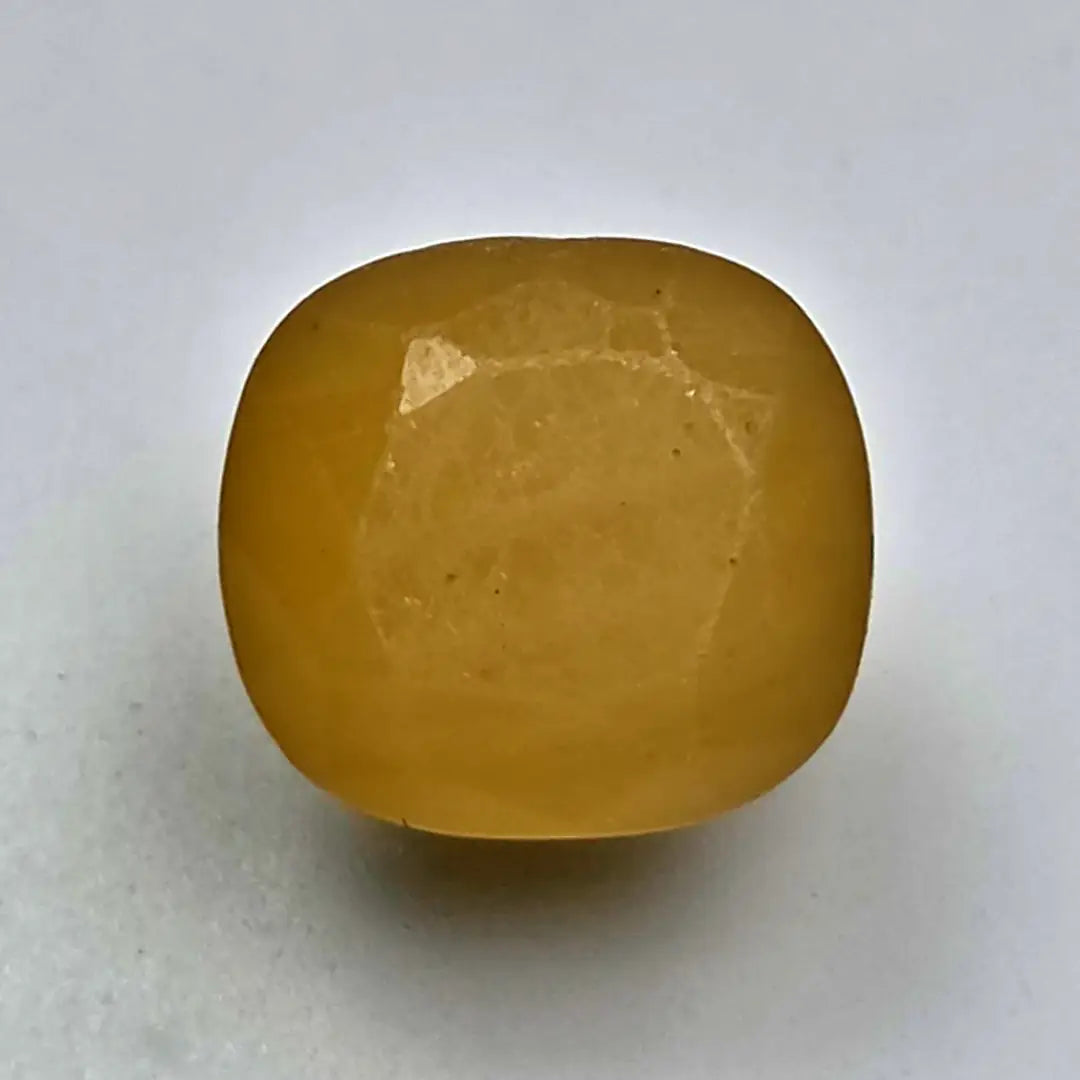 Ceylon Yellow Sapphire on a white background online India