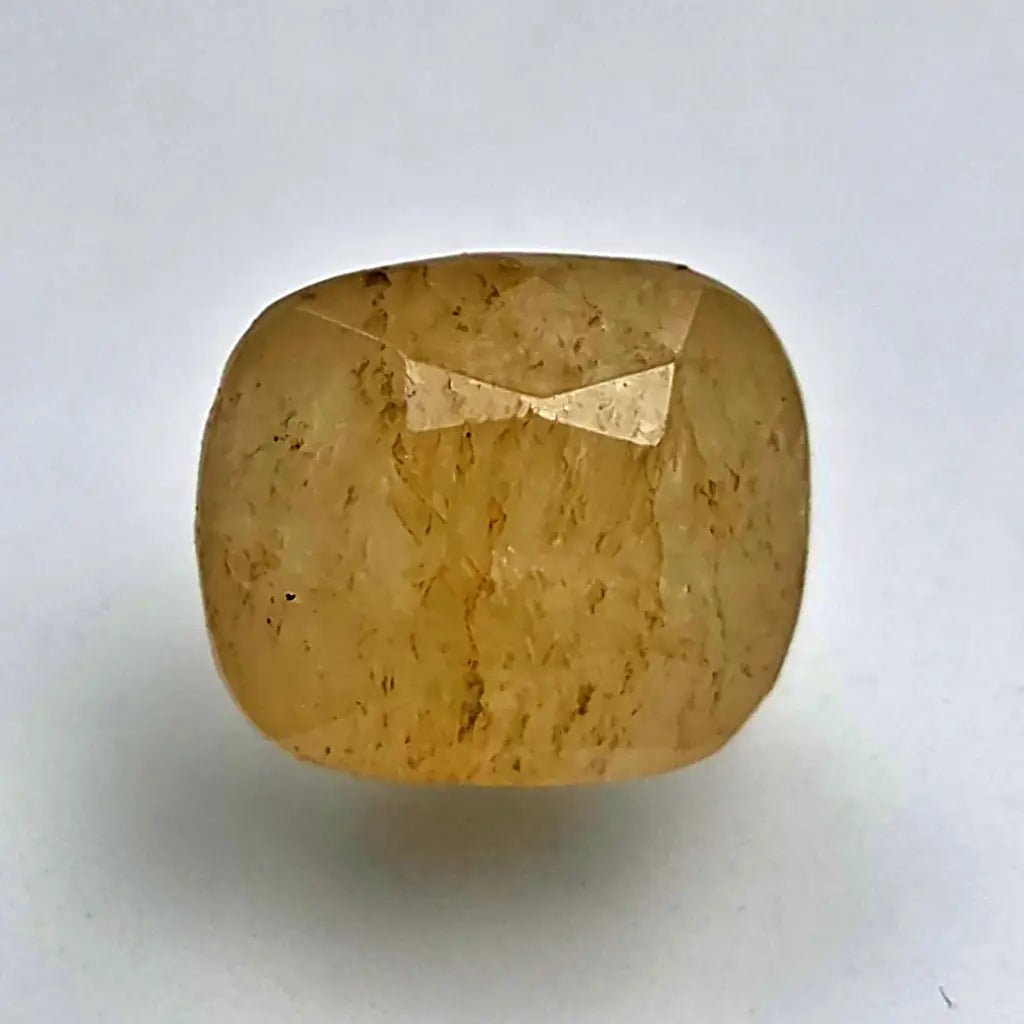 Square-cut Ceylon yellow sapphire stone on a white background online India