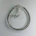 fashion anklet for women on a light grey background