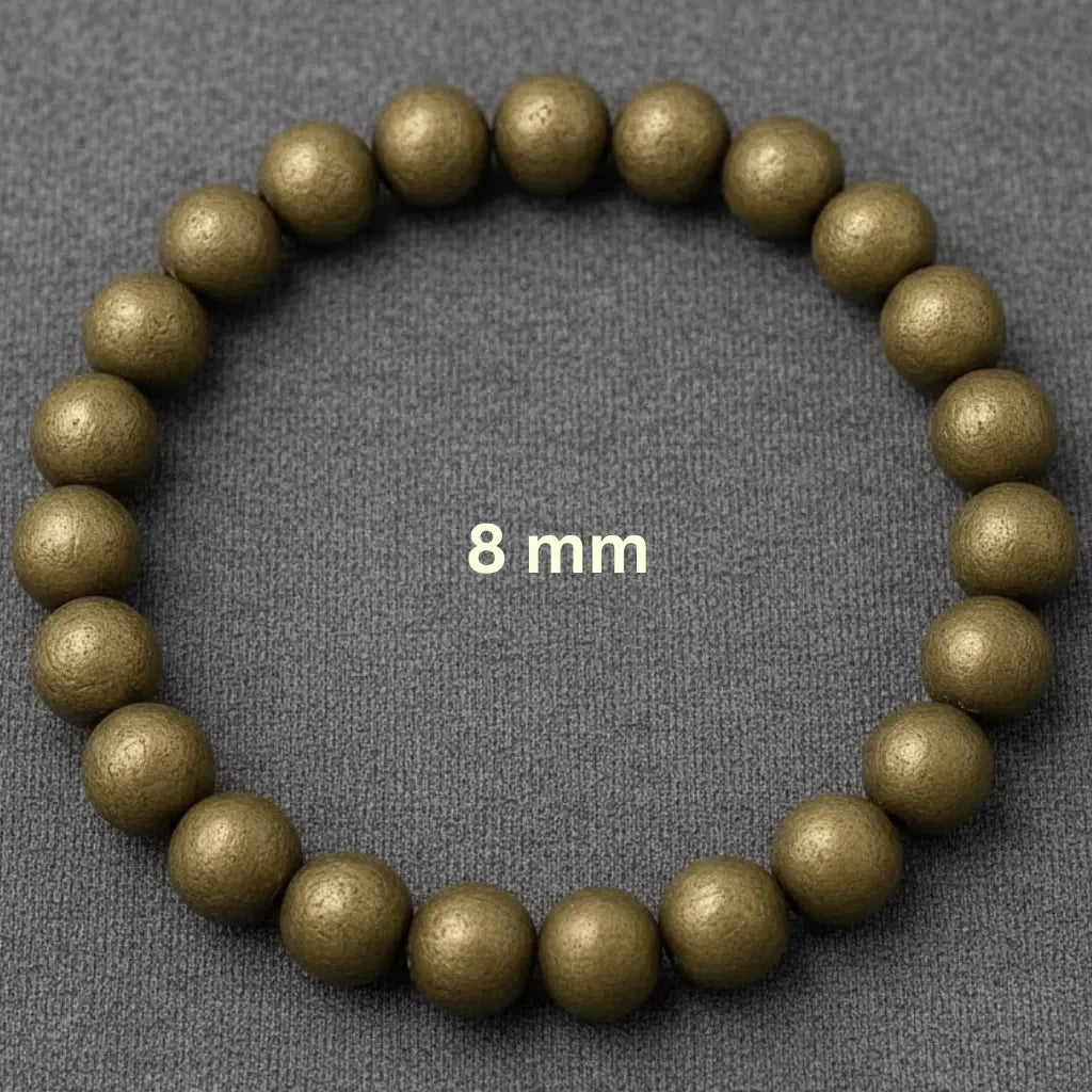 raw pyrite beaded bracelet with '8 mm' label on a gray background