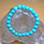 Turquoise beaded bracelet on a clear crystal rock